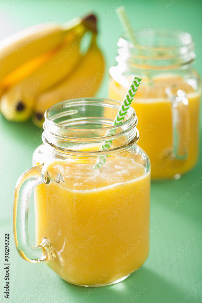 healthy yellow smoothie with mango pineapple banana in mason jar healthy yellow smoothie with mango pineapple banana in mason jar