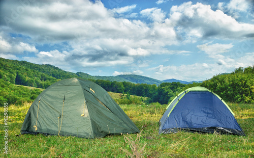 Two tents in the woods in the morning.