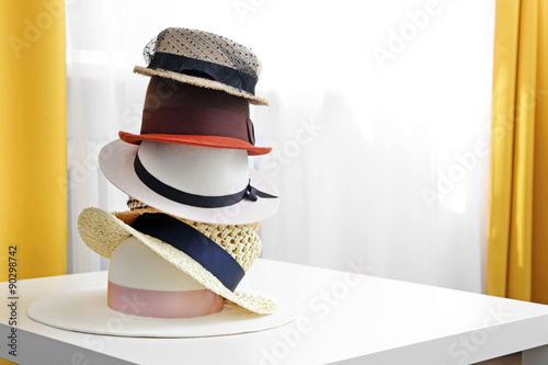 hat stack on white table in the room