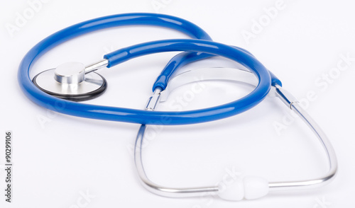 Blue stethoscope close-up on white background