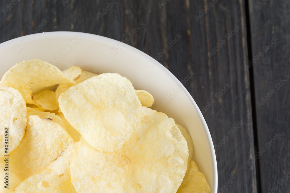 potato chips on wood background potato chips on wood background