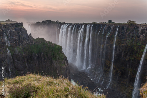 Victoria Falls from Zambia side at dusk  rocks in the foreground