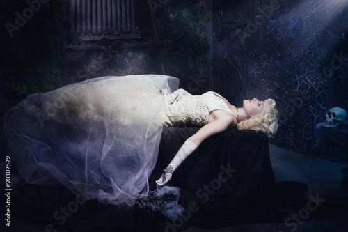 Принти на полотні Sleeping Beauty. Beautiful lifeless bride in white dress lying o