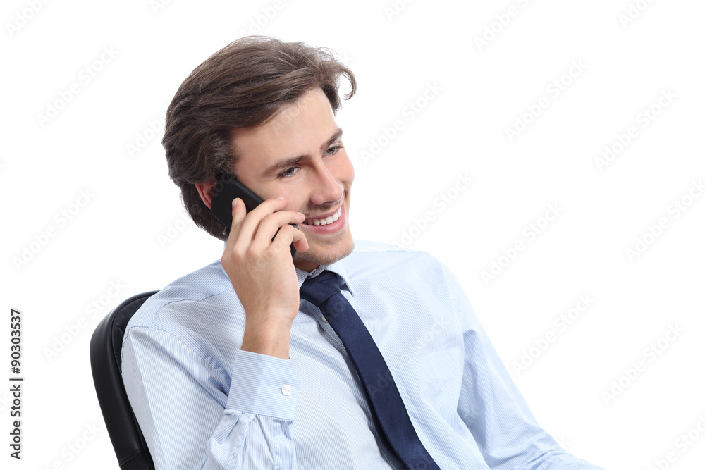 Happy sitting businessman working on the phone Happy sitting businessman working on the phone