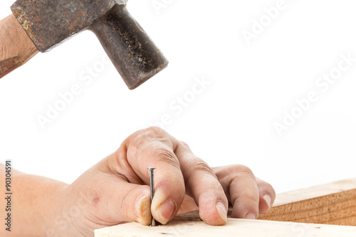 hammer and nail with wood