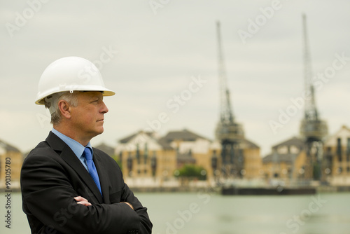 Businessman wearing white safety helmet. photo