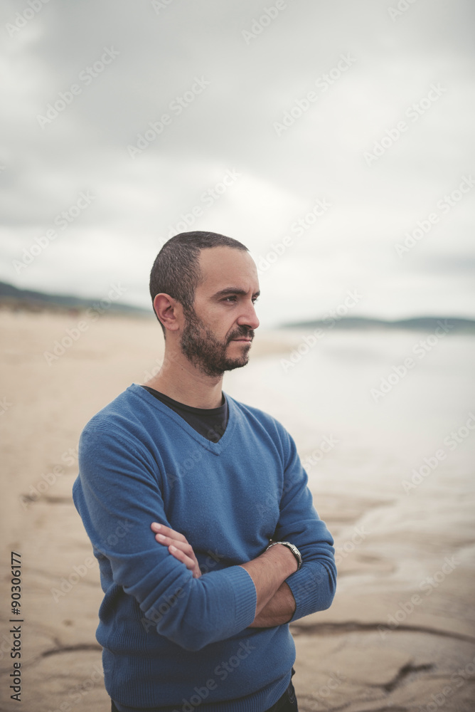 Thoughtful man on the beach