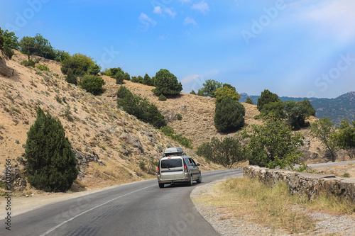 cars moving along mountain road in Crimea