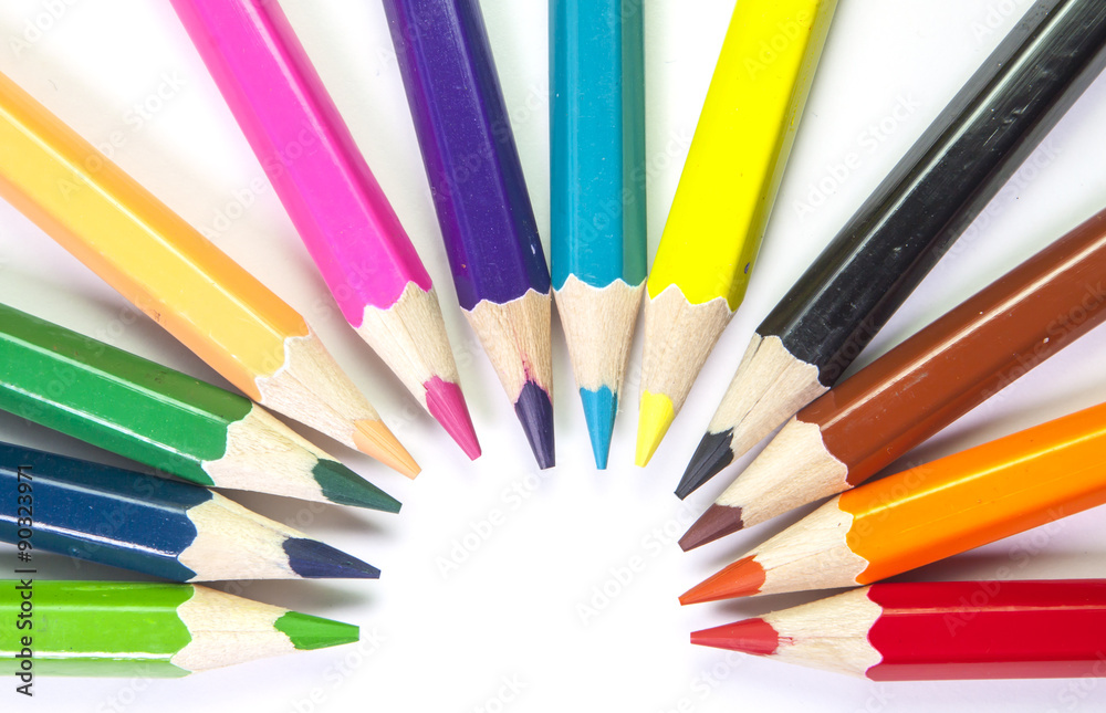 Line of colored pencils isolated on white background close up Line of colored pencils isolated on white background close up