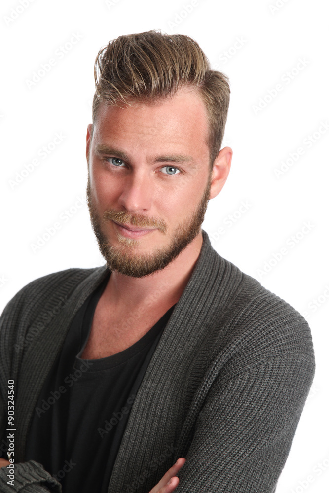 Fototapeta premium A handsome man standing with a white background wears a grey sweater and a black t-shirt. Feeling good with a smile on his face. 