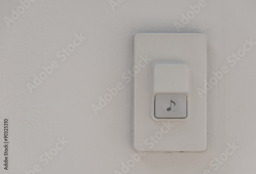 door bell on white wall