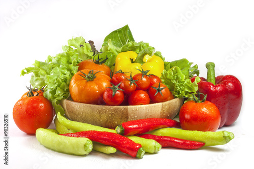 Mixed collection of vegetables isolated on a white background. Bowl of salad with fresh organic vegetables for healthy.