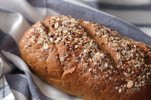 Photos Dark multigrain bread whole grain fresh baked on rustic