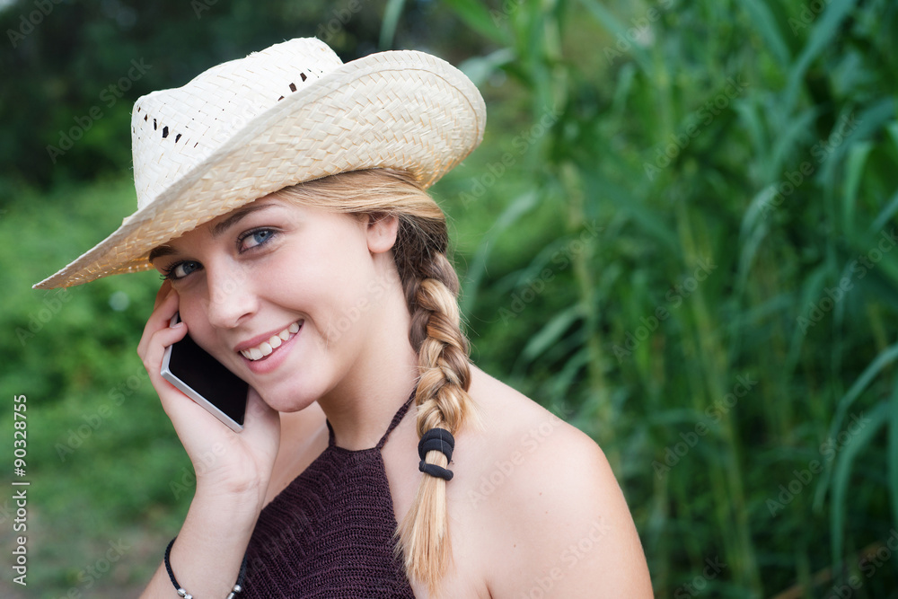 girl young speech by telephone smiling in the field space for te