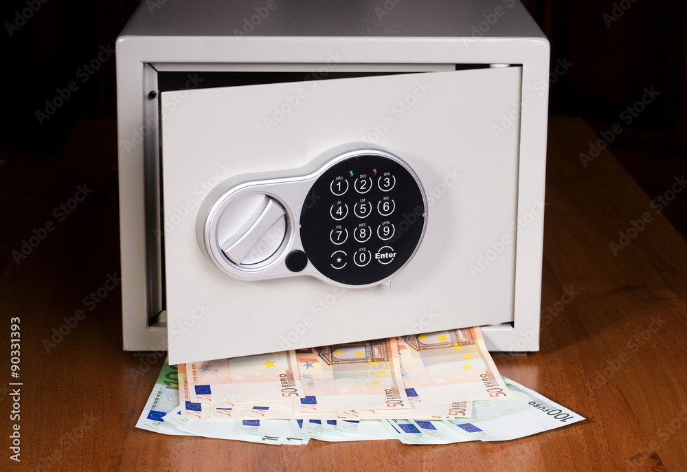Safe with euro on wooden shelf Safe with euro on wooden shelf