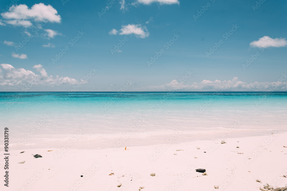 Fototapeta premium blue sky with sea and beach - soft focus with film filter