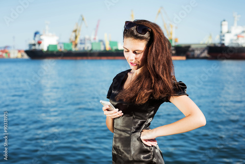 young business woman texting message on phone © kurapatka