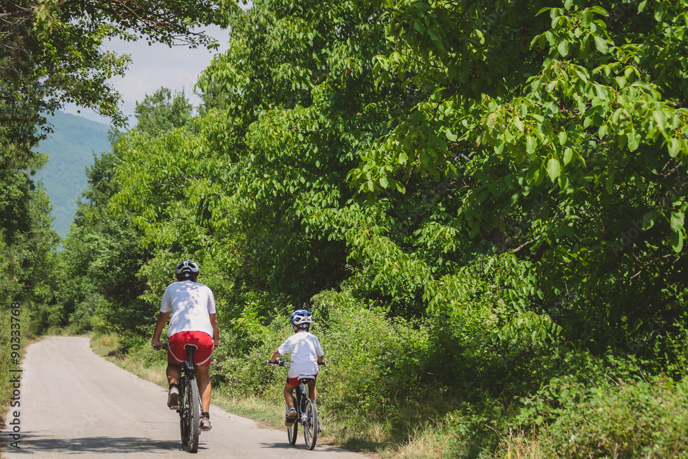 Obraz premium Father and son cycling