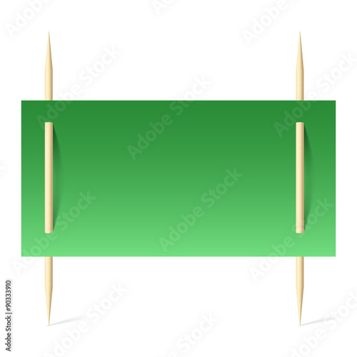 Green paper on toothpicks photo