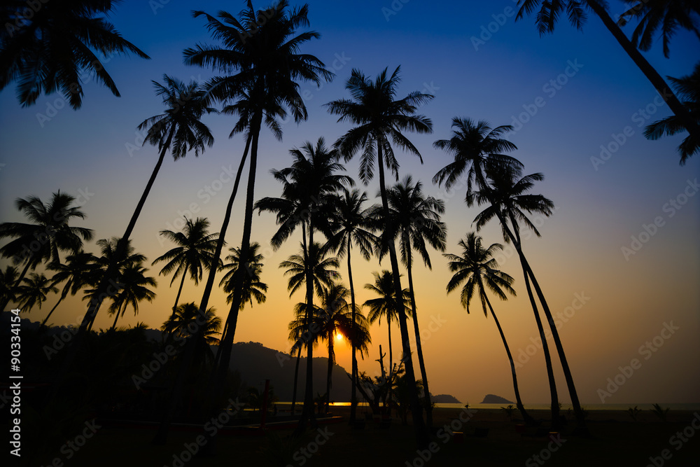 Beautiful sunset at a beach resort in tropics.