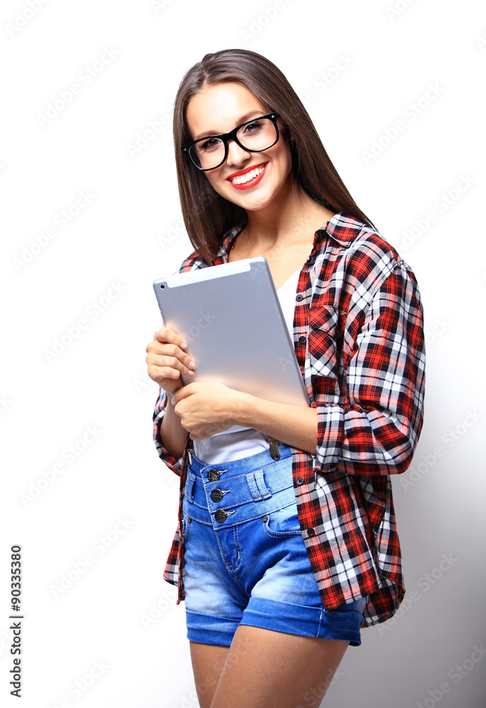 Woman holding tablet computer isolated on white background. Woman holding tablet computer isolated on white background.