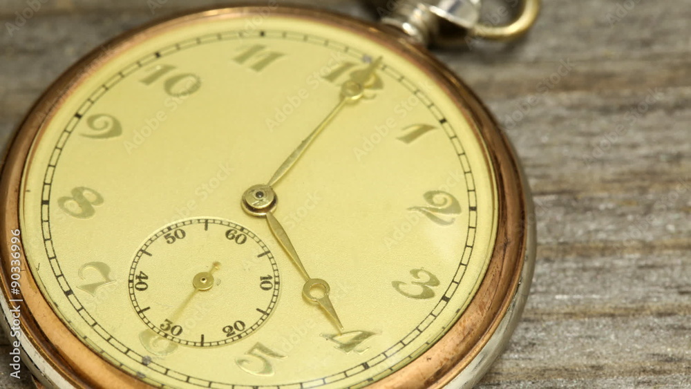 Antique pocket watch on rustic table time lapse Antique pocket watch on rustic table time lapse
