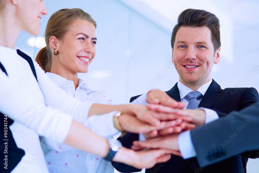 Business people with their hands together in a circle Business people with their hands together in a circle