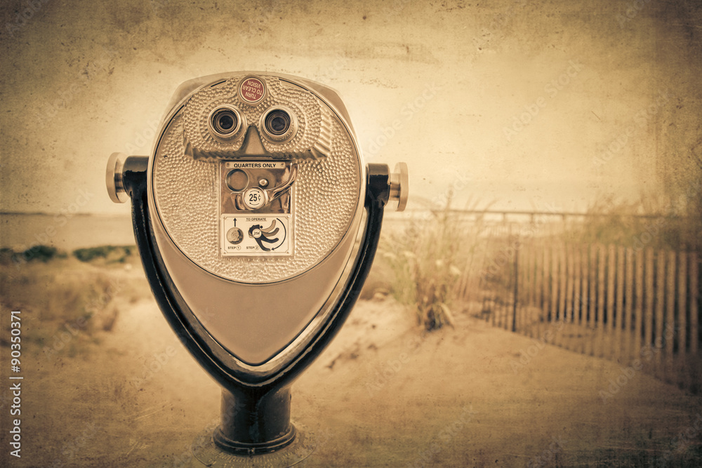 Vintage effect coin operated binoculars at beach