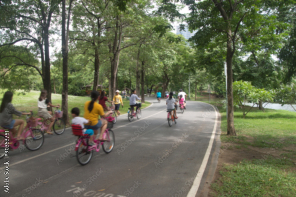 people cycling in the park