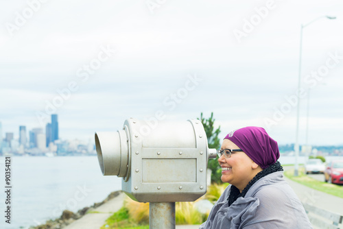 Middle Aged Female Using Public Telescope