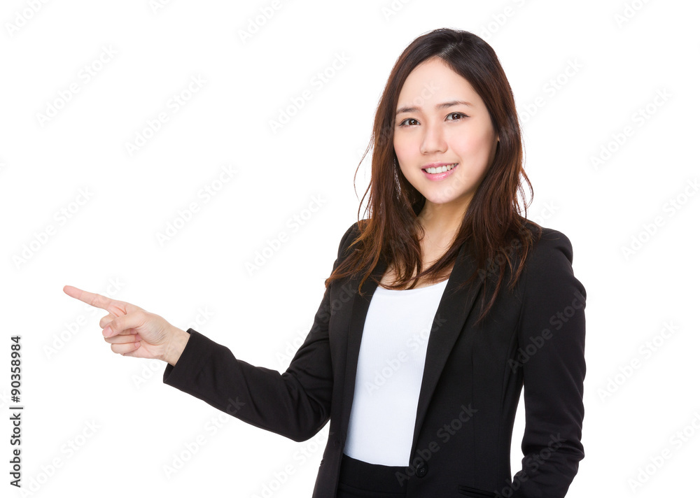 Asian young businesswoman with finger point aside Asian young businesswoman with finger point aside
