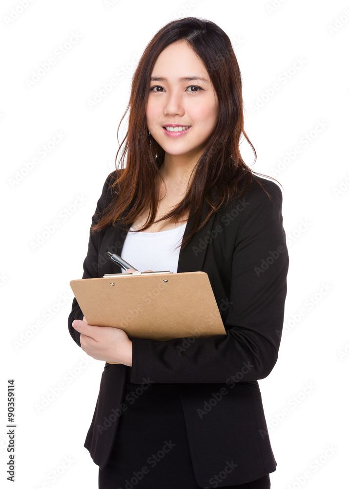 Asian young businesswoman take note on clipboard Asian young businesswoman take note on clipboard