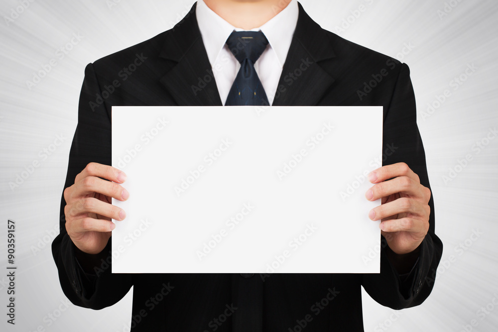 Businessman holding on blank whiteboard. Businessman holding on blank whiteboard.