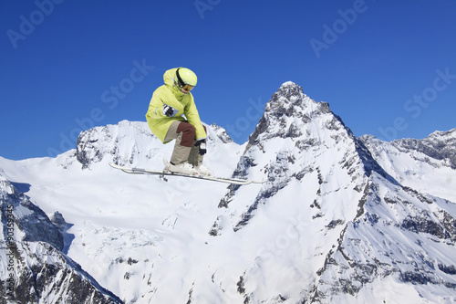 Flying skier on mountains