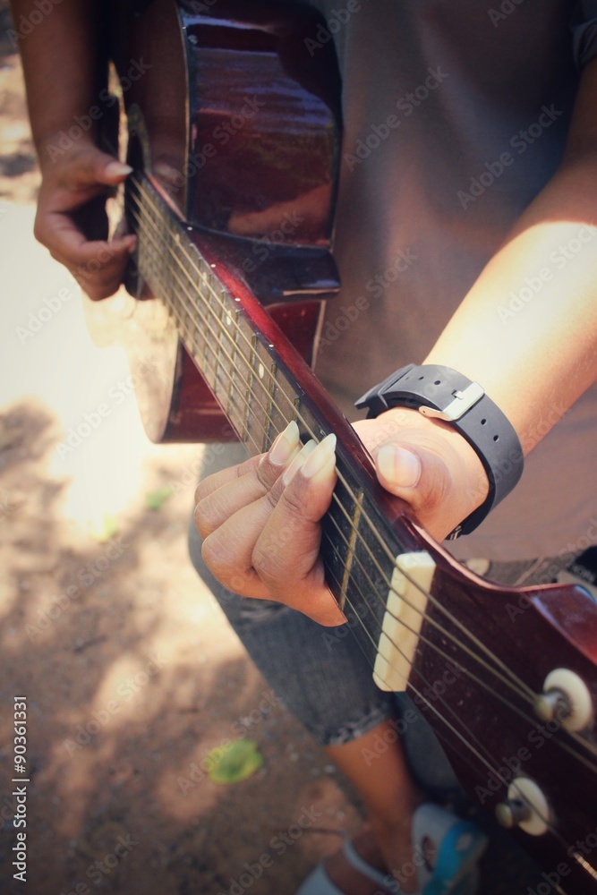 Fototapeta premium Woman playing the guitar