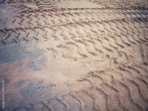 Wheel tracks on the soil.