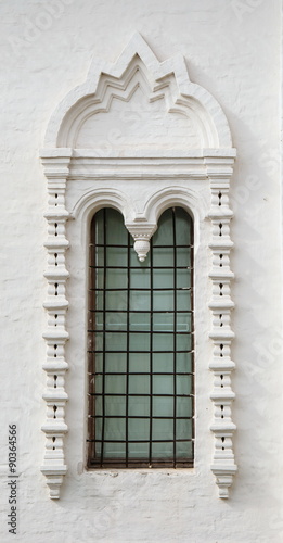 Beautiful window on the wall of an old building in the style ancient Russian architecture