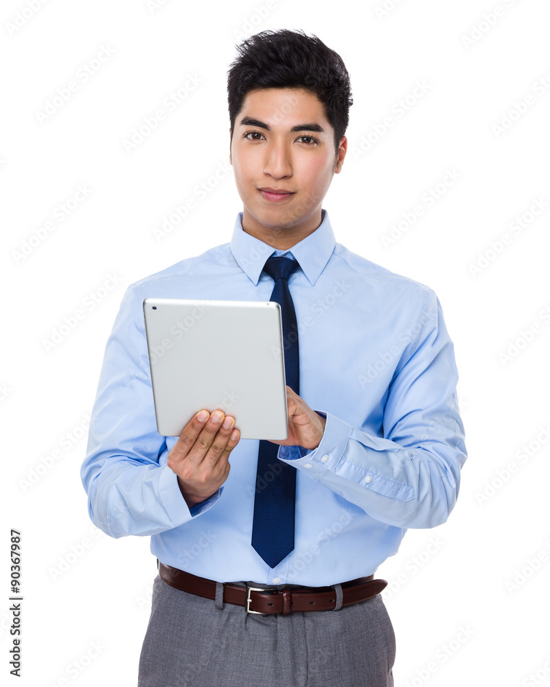Young businessman use of the digital tablet Young businessman use of the digital tablet