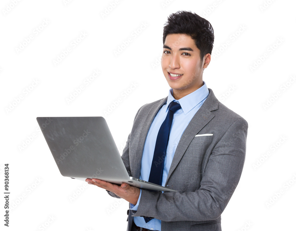 Young businessman use of the laptop computer Young businessman use of the laptop computer