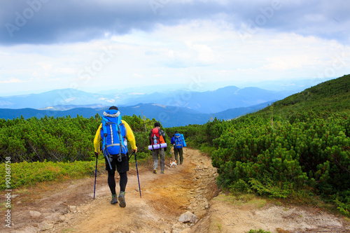 Nordic walking people, Group three guys in a hike in the mountains. Series of photos