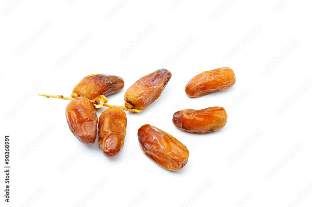 Dried Kurma. popular in month of Ramadhan. also known as a diet dish..Eaten in fasting month for muslim people. Pile of dried date fruits isolated on a white background. Dried Kurma. popular in month of Ramadhan. also known as a diet dish..Eaten in fasting month for muslim people. Pile of dried date fruits isolated on a white background.