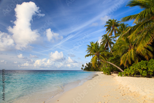 tropical sand beach against blue sky