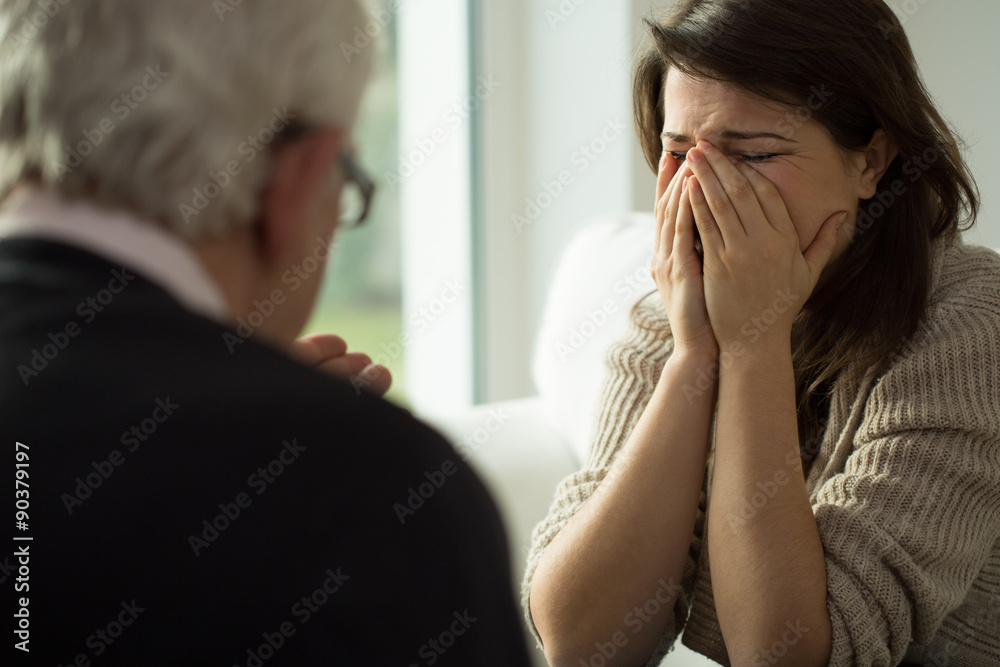 Young woman crying during therapy Young woman crying during therapy