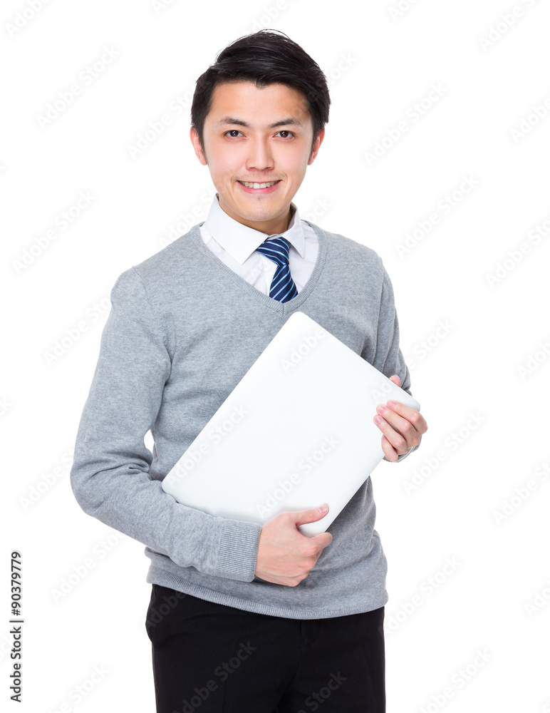 Asian young businessman hold with laptop computer Asian young businessman hold with laptop computer