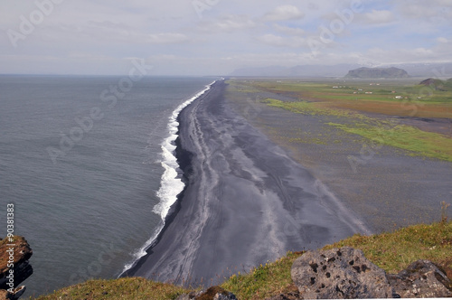 Dyrhólaey peninsula in south Iceland, coastline with black sand © tylwithteg1