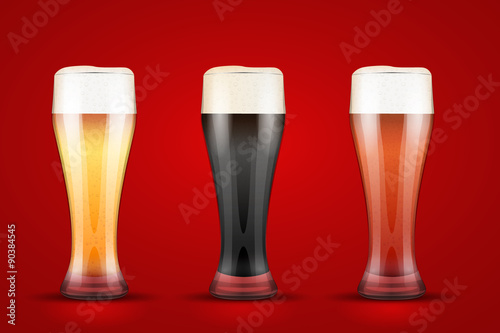 Beer glass with three brands. photo