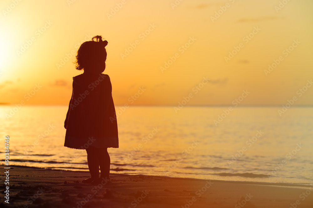 silhouette of little girl walking at sunset Stock Photo | Adobe Stock