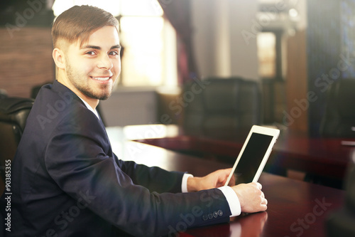 Businessman working with tablet in office