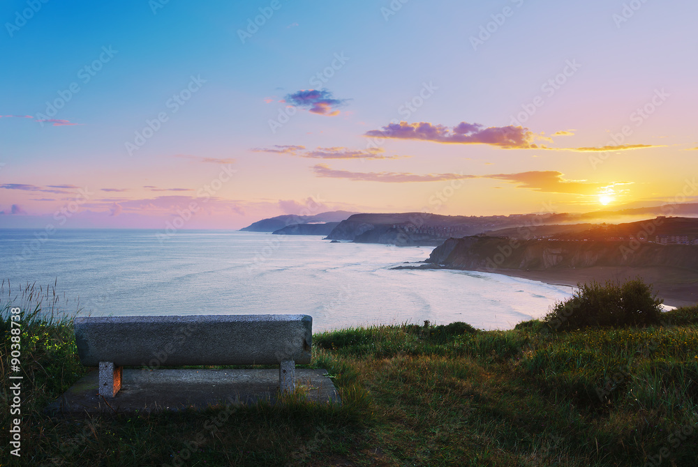 bench with view of Sopelana coast at sunrise