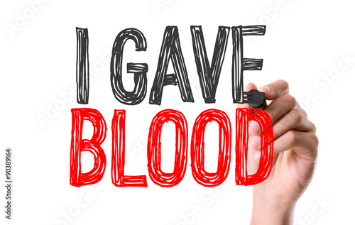 Hand with marker writing the word I Gave Blood photo